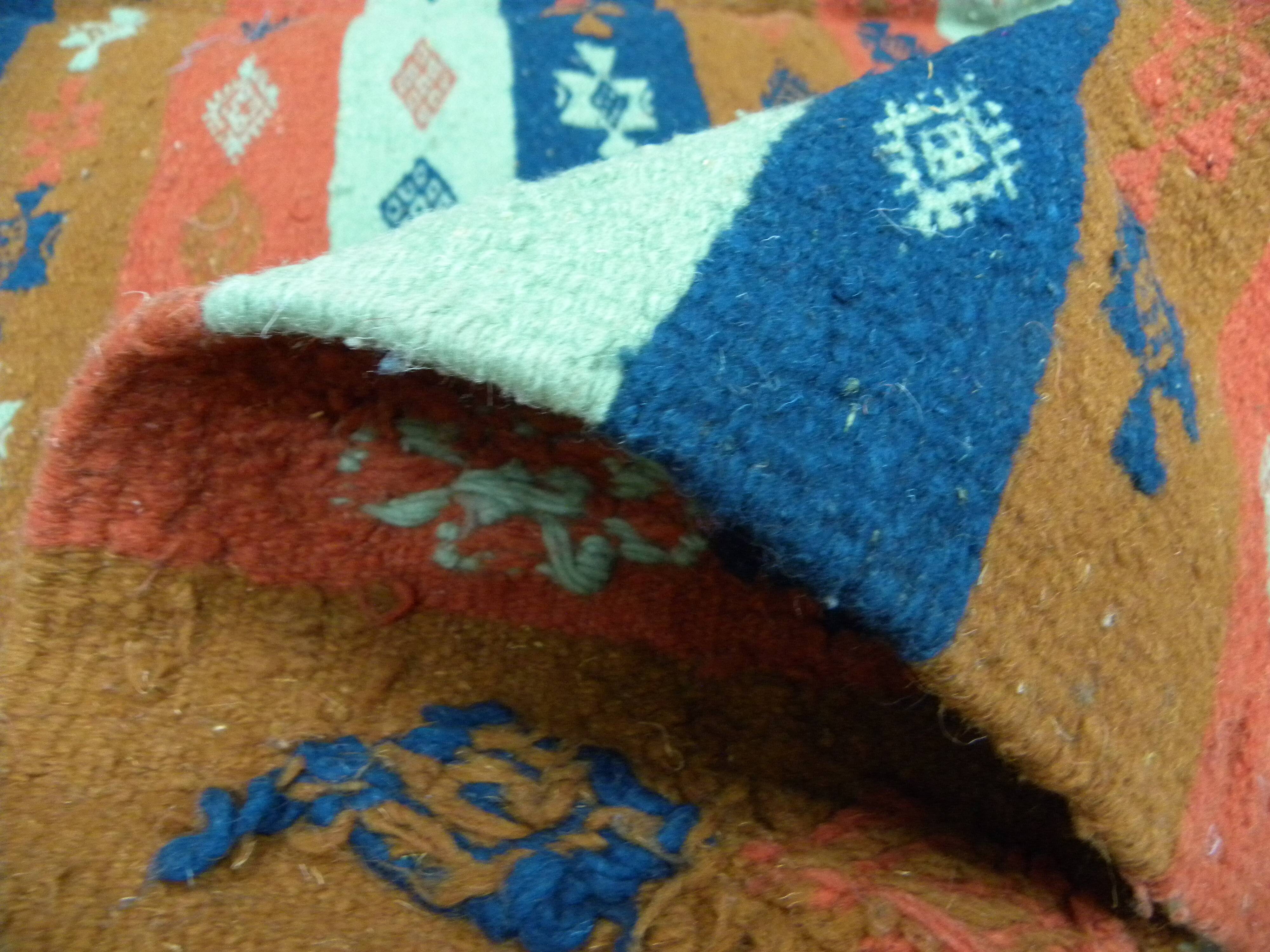 Authentic handmade Tunisian Berber kilim rug in orange wool.