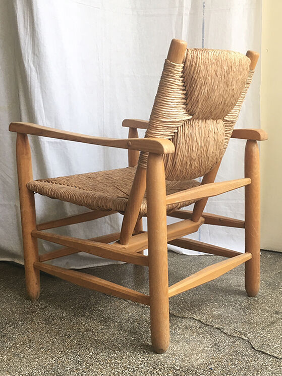 "Paillé" armchair by Charlotte Perriand