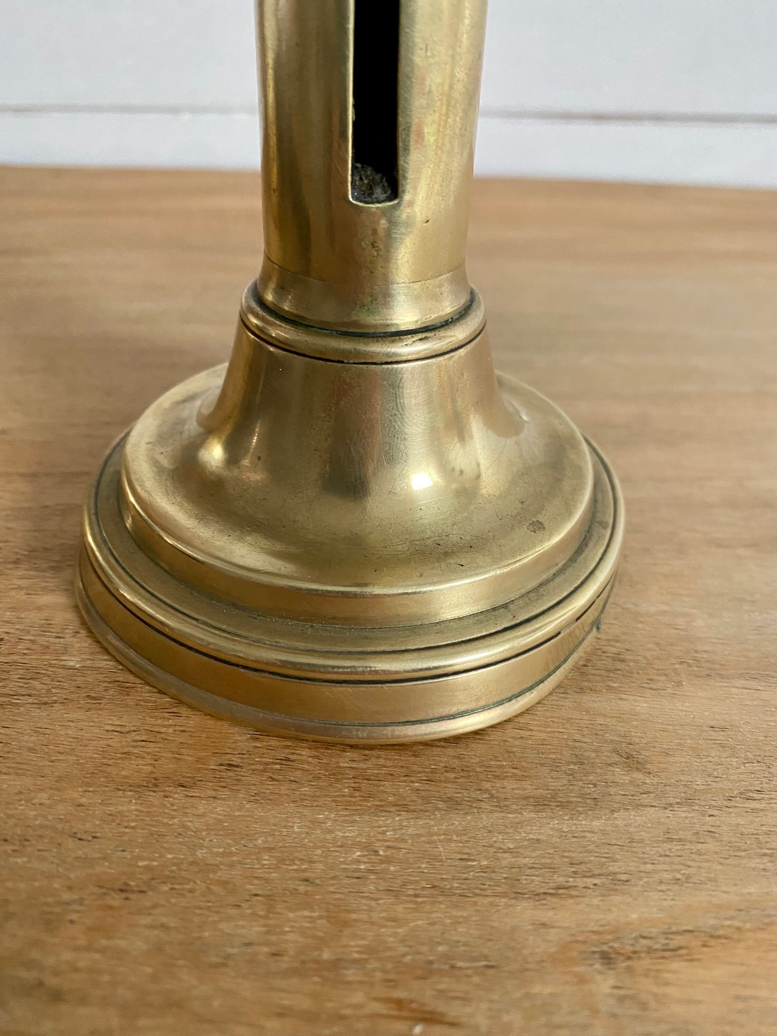 Nineteenth-century brass pull-out candle holder