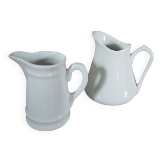 2 small white porcelain pitchers