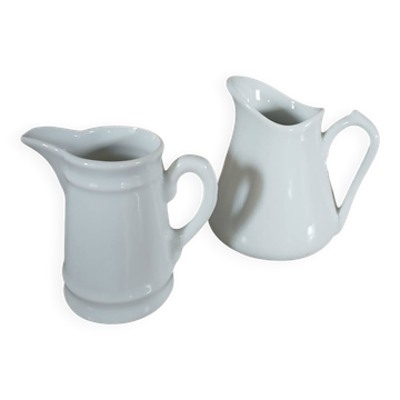 2 small white porcelain pitchers