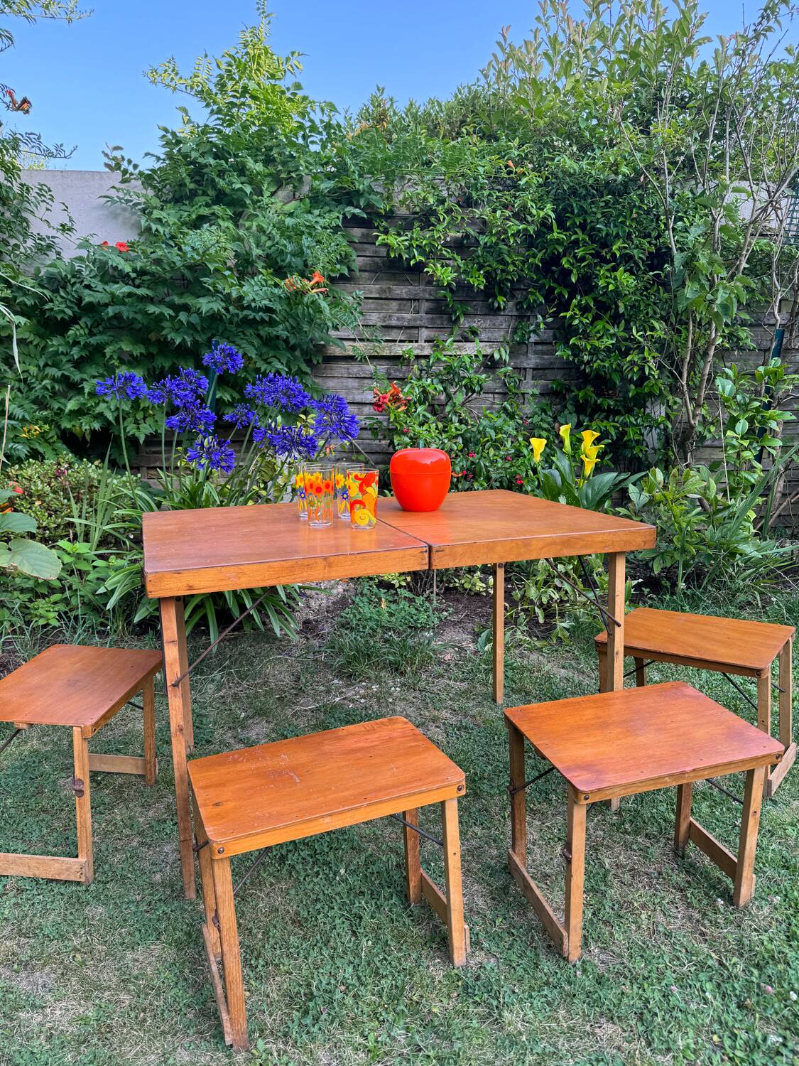 Old suitcase, table and stools, vintage wooden picnic