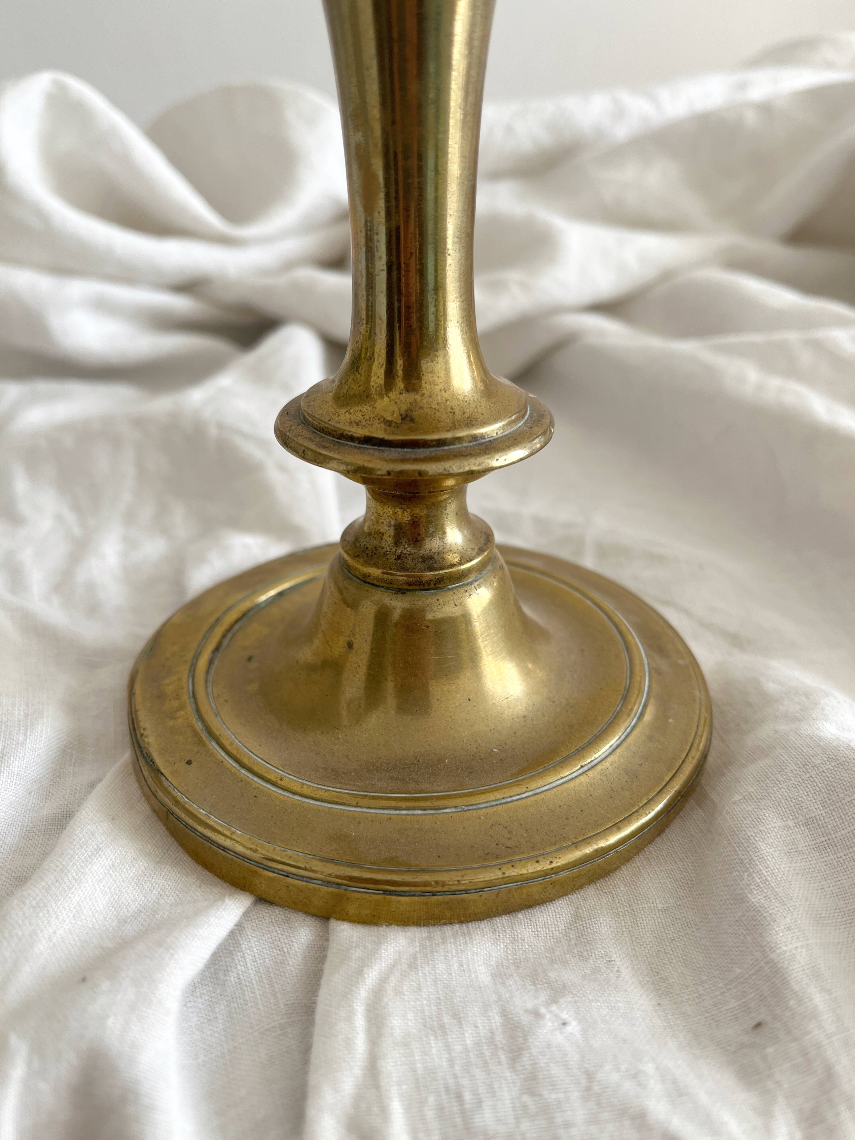 Antique brass candlestick in vintage baluster shape