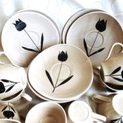 Vintage 23-piece Niderviller coffee set with hand-painted black tulip decor.