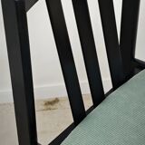 Set of 6 modernist black chairs with light blue-green ribbed fabric.