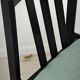 Set of 6 modernist black chairs with light blue-green ribbed fabric.