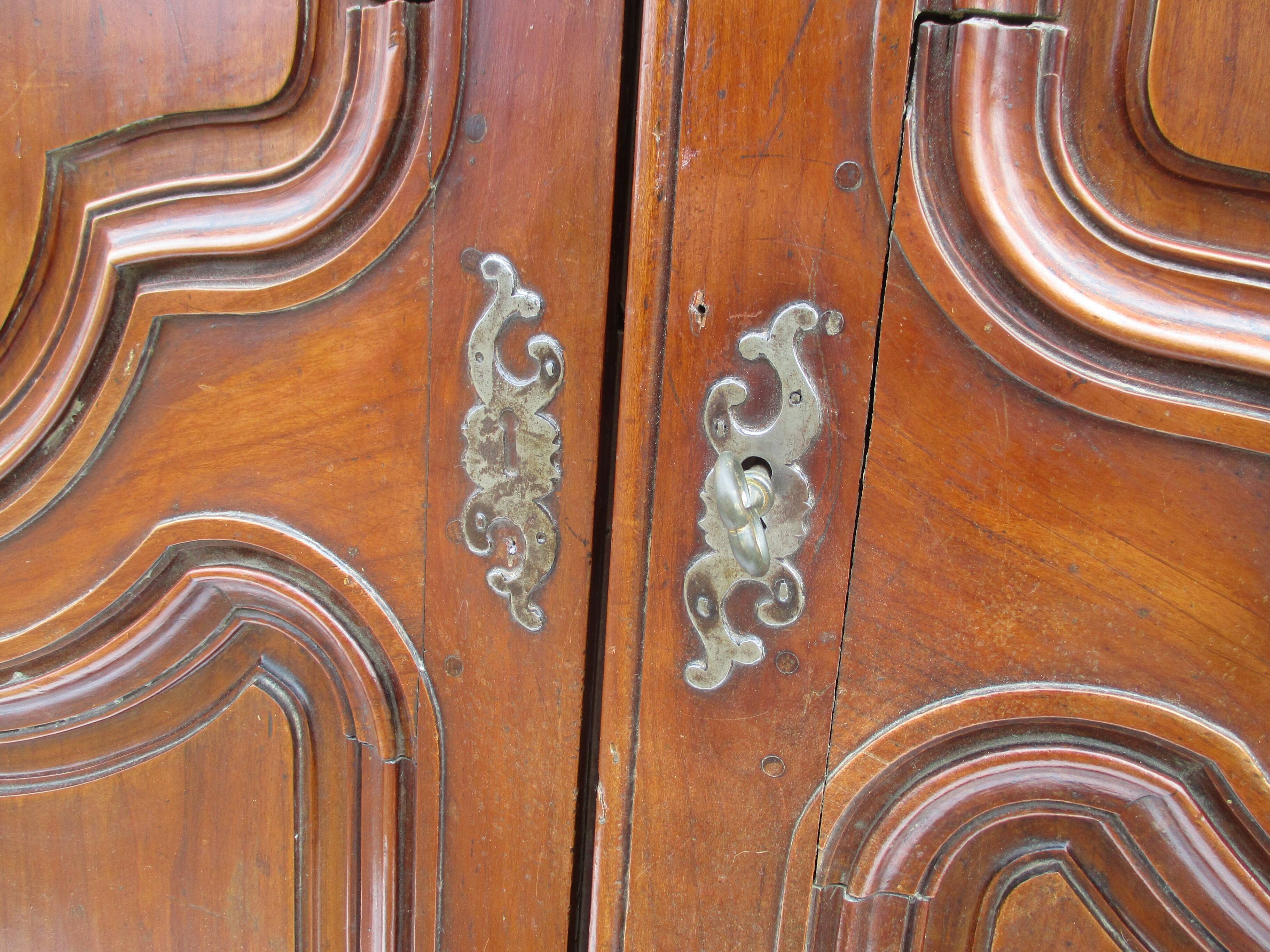 Small solid wooden cabinet with a gendarme hat