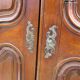 Small solid wooden cabinet with a gendarme hat