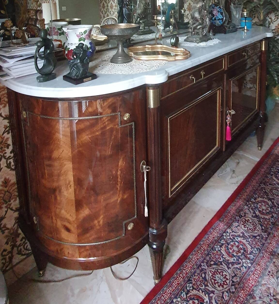 Louis XVI style sideboard in flame mahogany veneer.