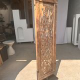 Rectangular Indonesian construction element with blue and yellow plant in carved wood