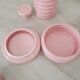 Set of pink and gold ceramic bathroom accessories