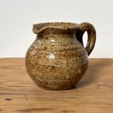 Small beige speckled stoneware pitcher
