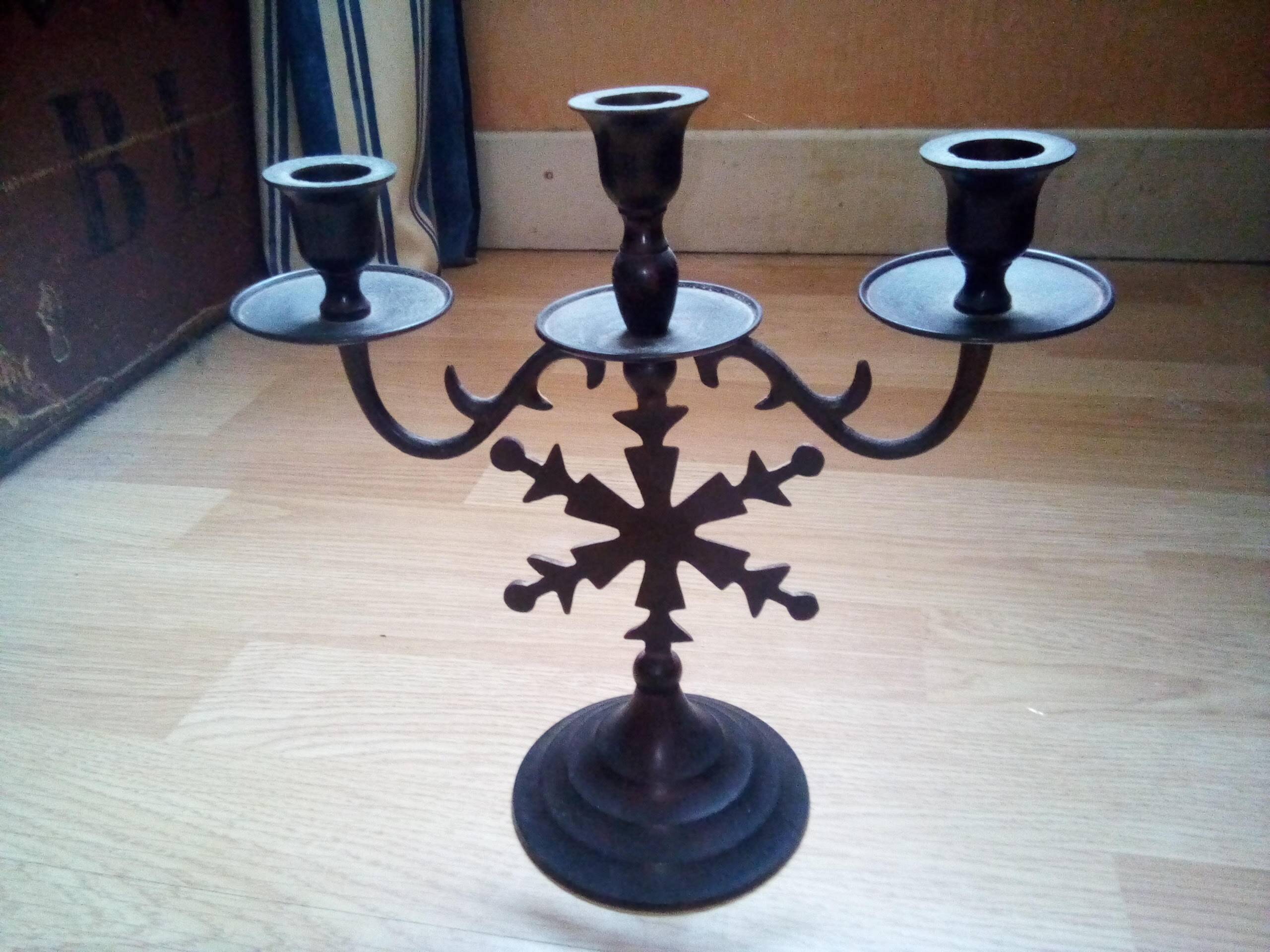 Three-branched black metal candelabra in gothic style