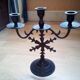 Three-branched black metal candelabra in gothic style