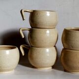 Six vintage potter's ceramic cups with vanilla enamel