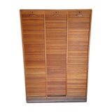 Filing cabinet has curtains, notary furniture. 3 columns