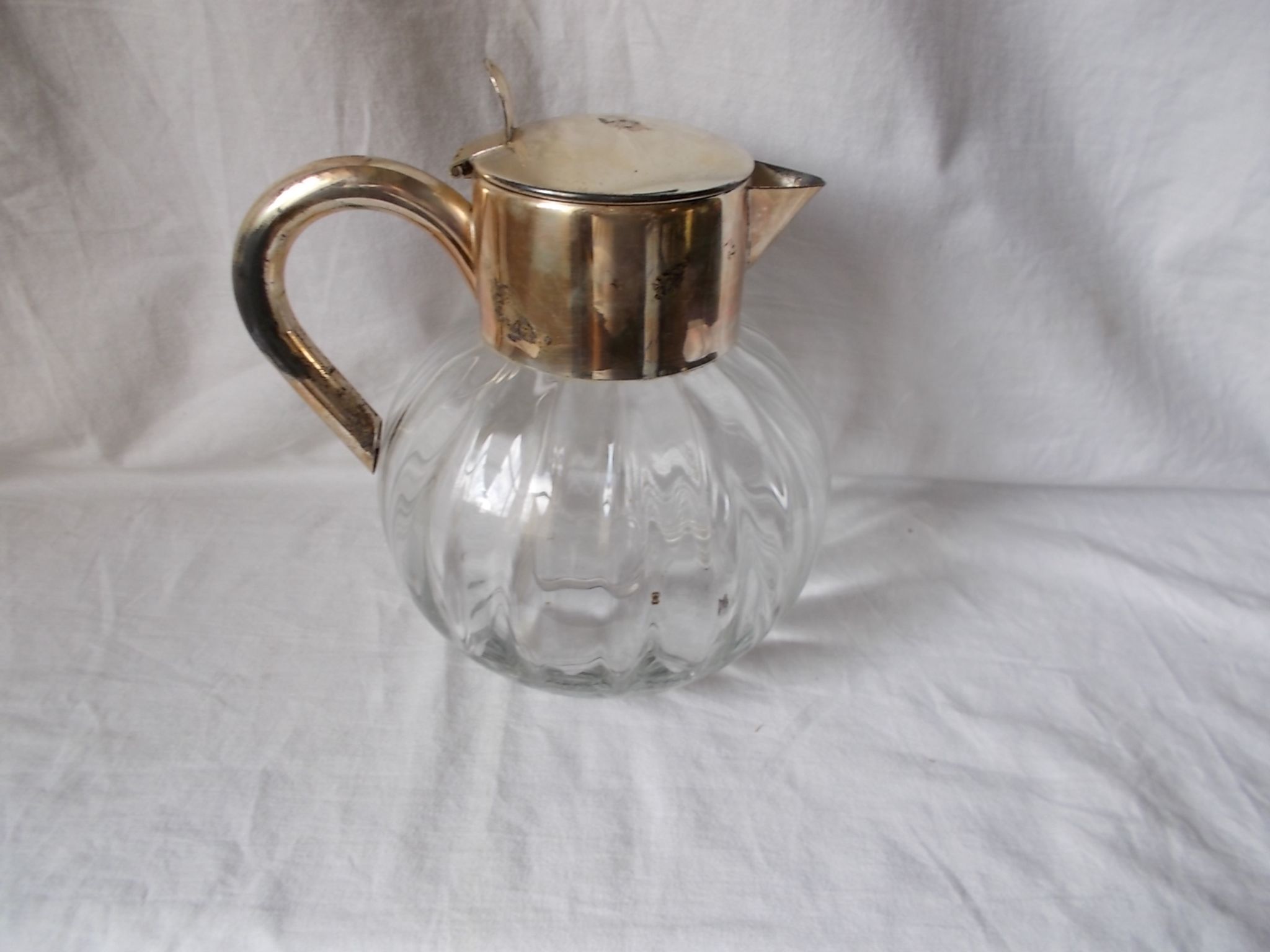 Lemonade and orangeade pitcher with ice reserve.