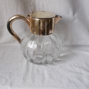 Lemonade and orangeade pitcher with ice reserve.