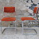 Pair of orange velvet chairs Roche Bobois 70s