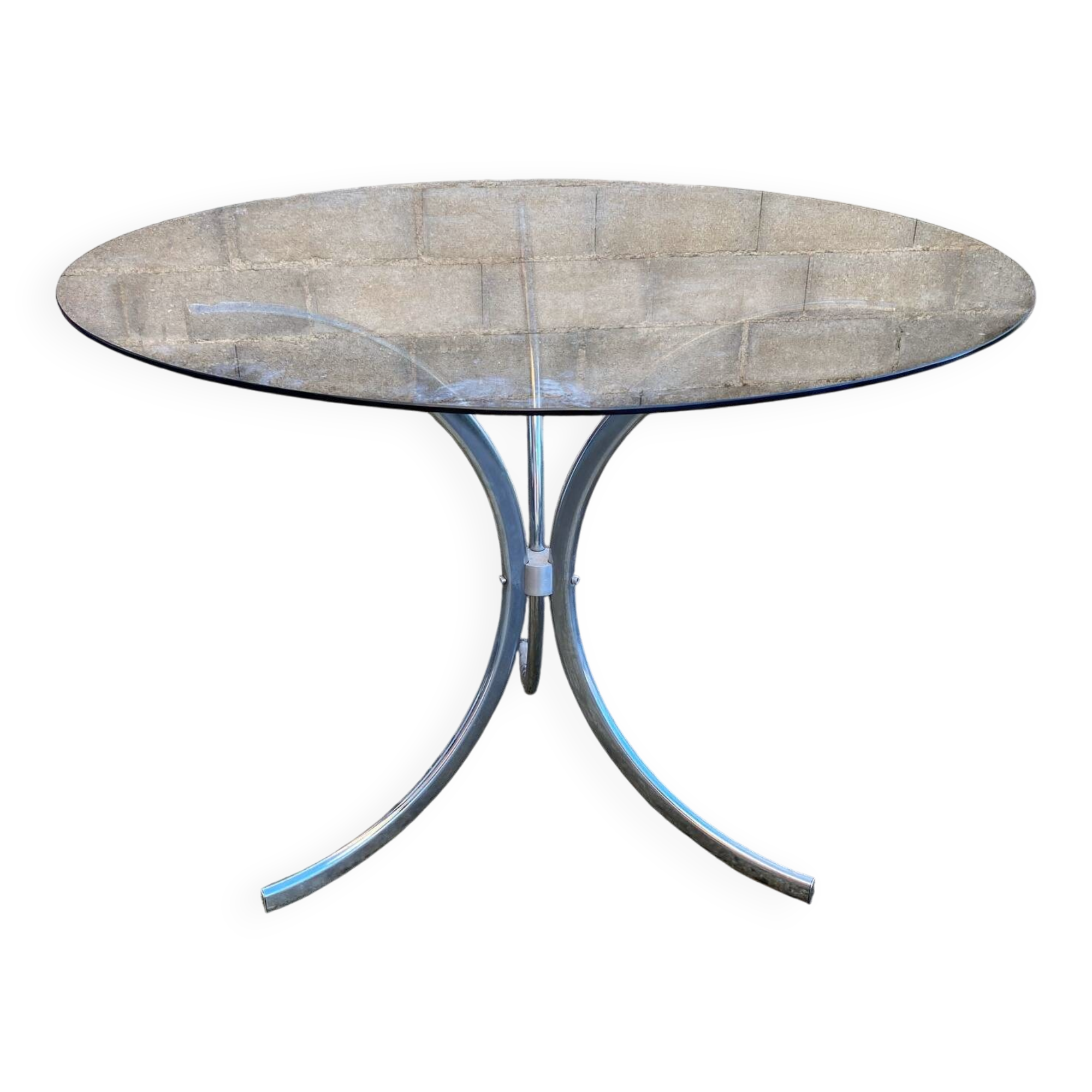 Table with chrome metal legs and smoked glass top.