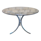 Table with chrome metal legs and smoked glass top.