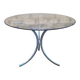 Table with chrome metal legs and smoked glass top.