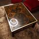 Coffee table in exotic wood, brass trim and planisphere under glass.