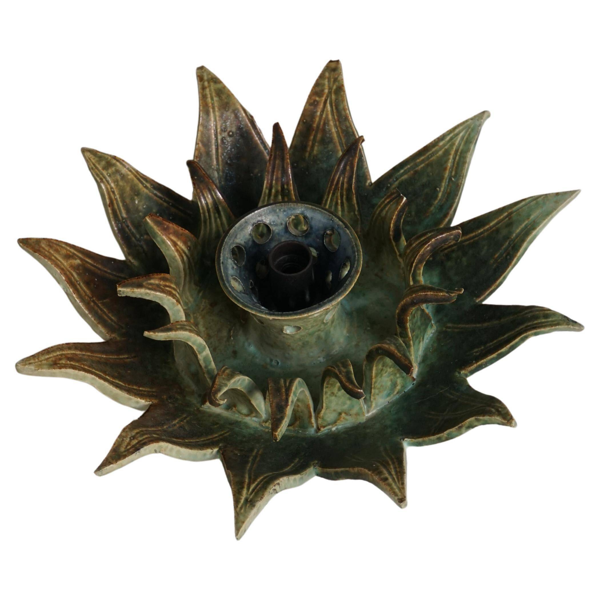 Wall lamp or decorative wall sculpture in ceramic in the shape of a sun, mid-20th century, 1960.