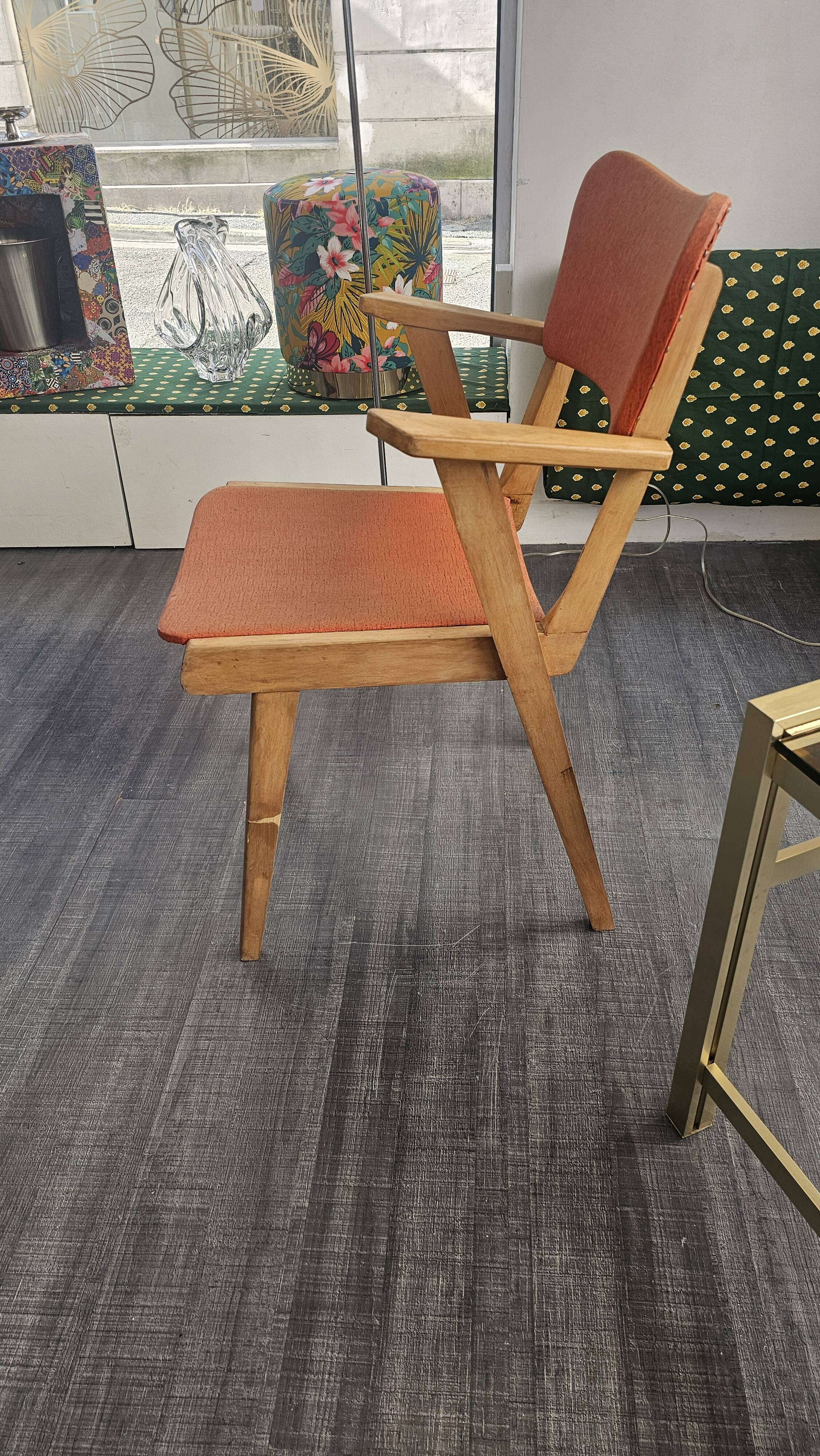 Modernist armchair in wood and orange fabric
