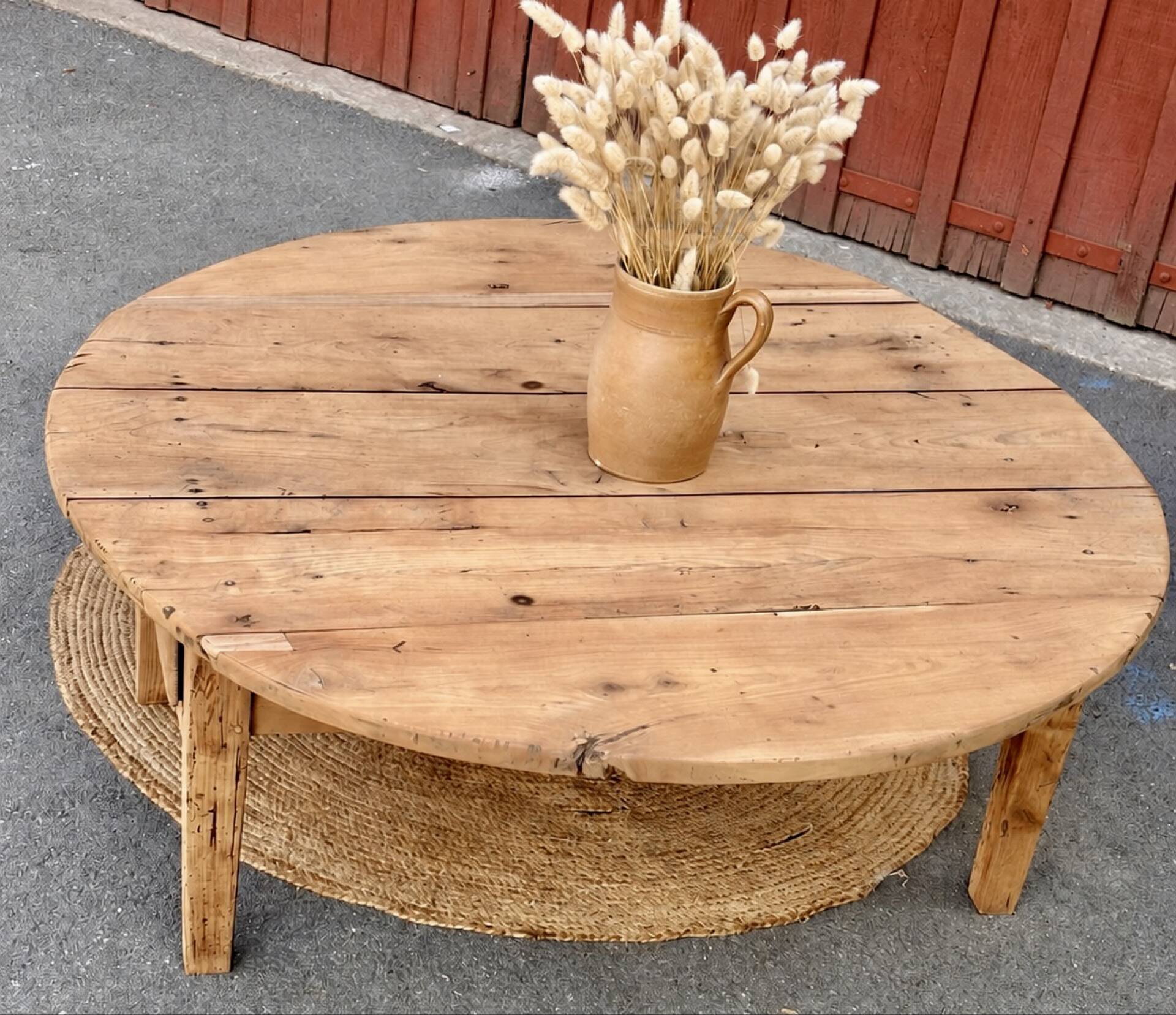 Round coffee table with 1 drawer, antique, made of raw solid wood.