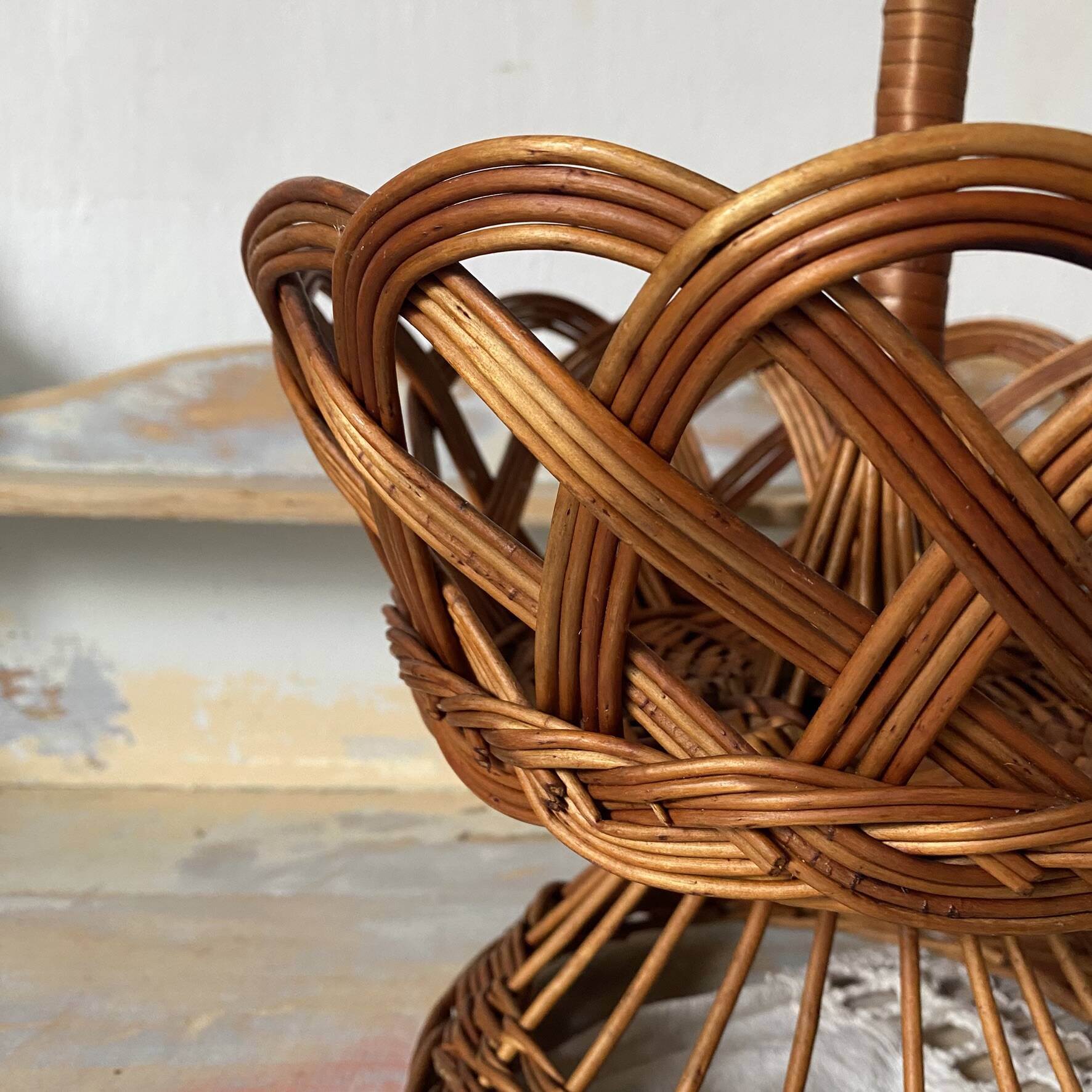 Wicker fruit bowl on a stand