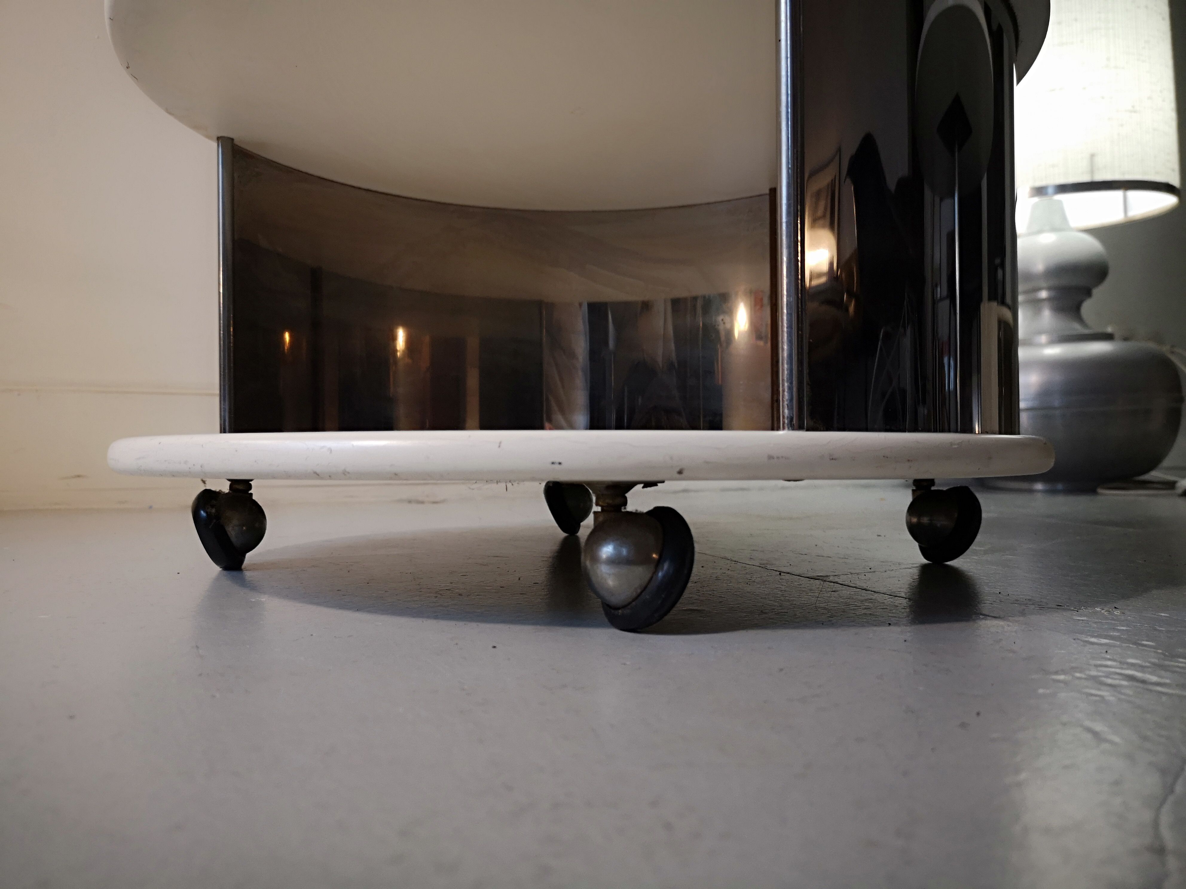 Pair of mirrored space age cylindrical bedside tables, 1960