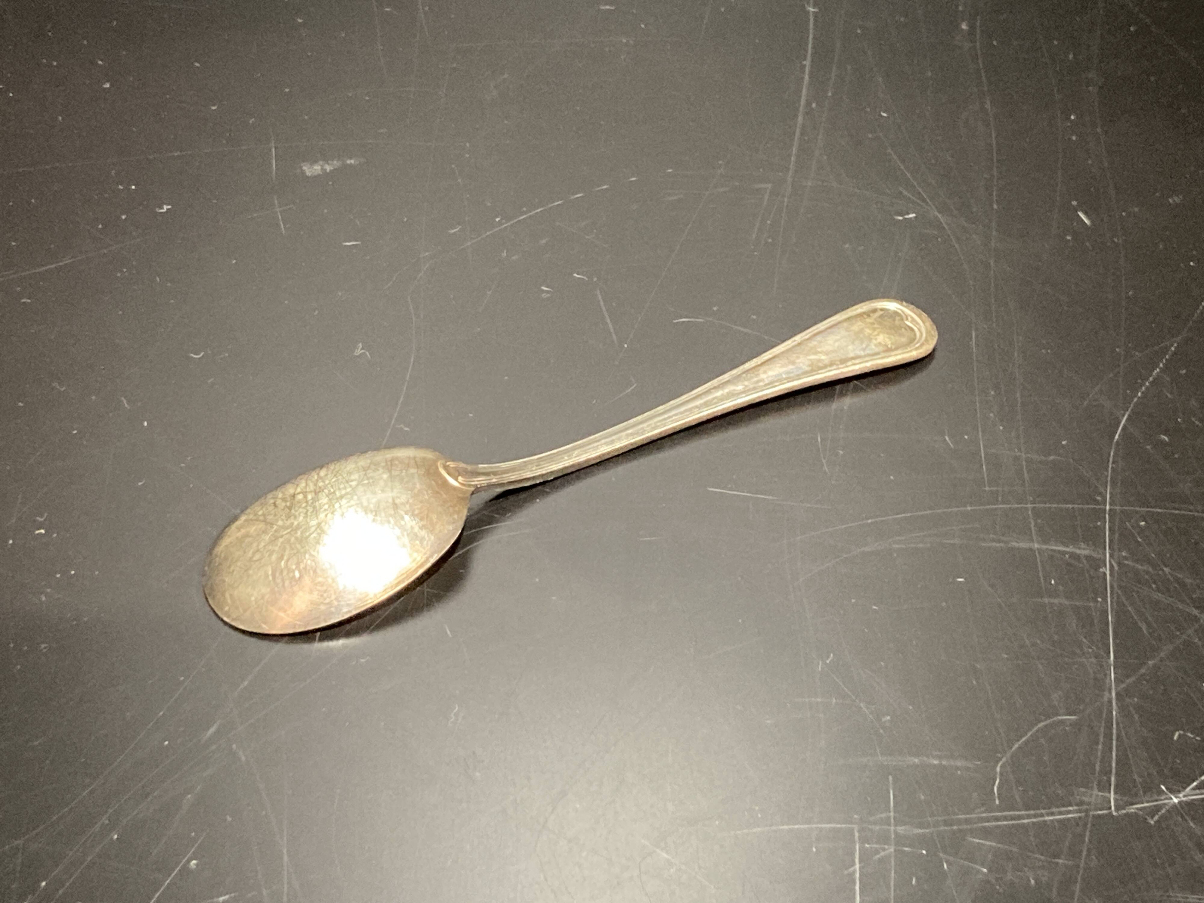 Egg cup with silver metal spoon