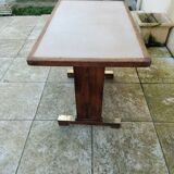 Old bistro table in wood and brass.