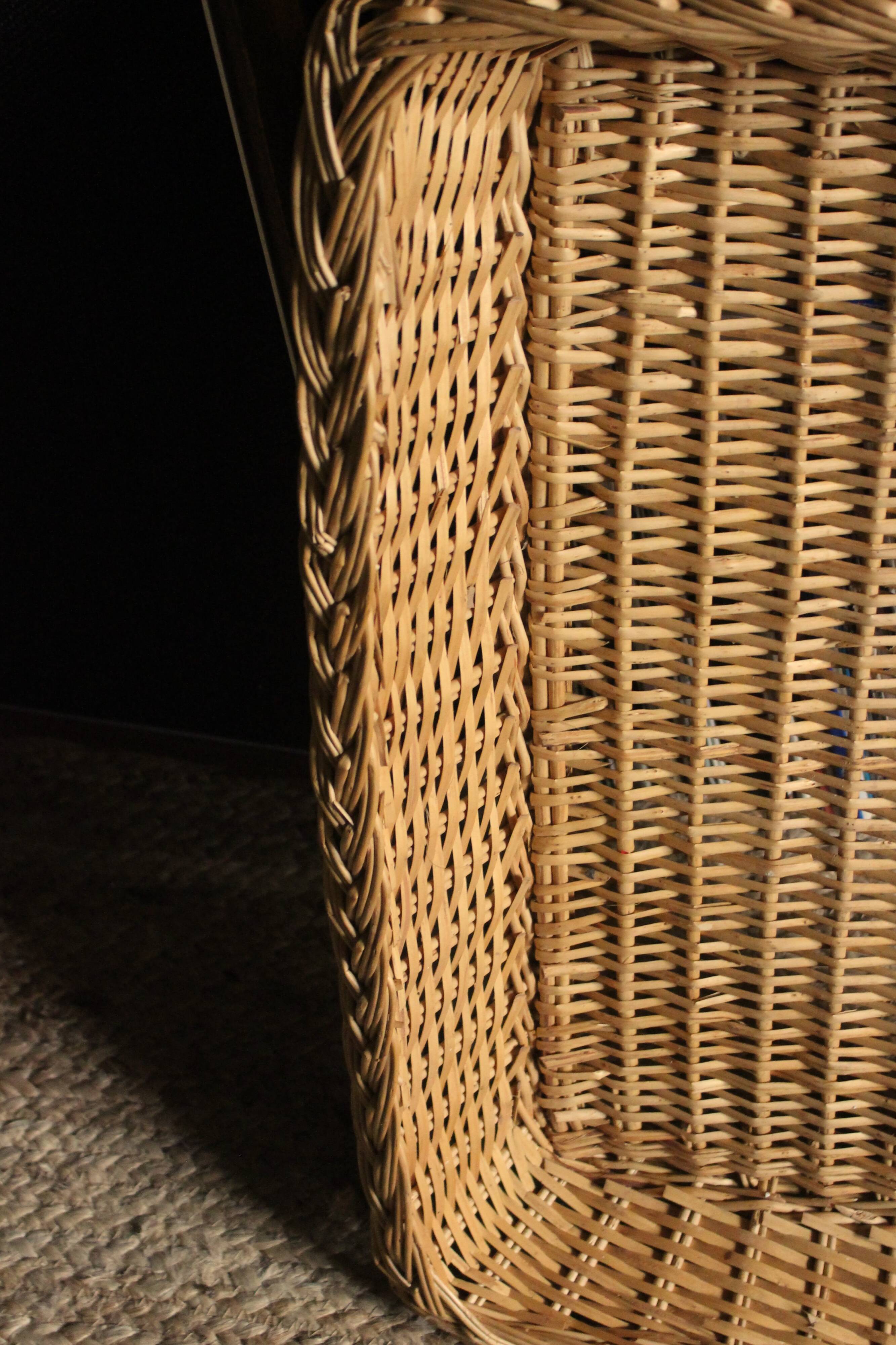 A large vintage rectangular wicker basket