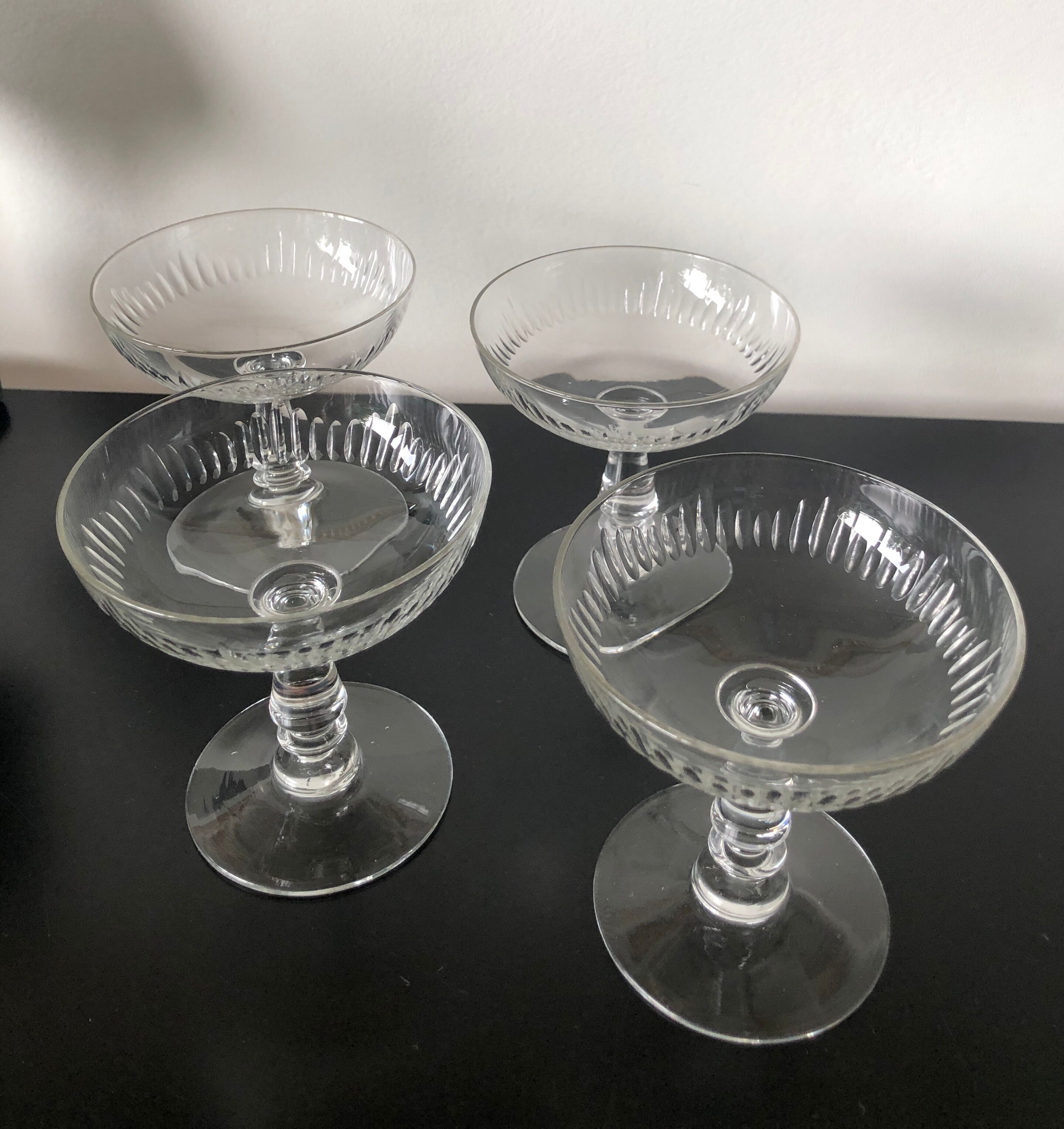 4 glasses of carved crystal champagne