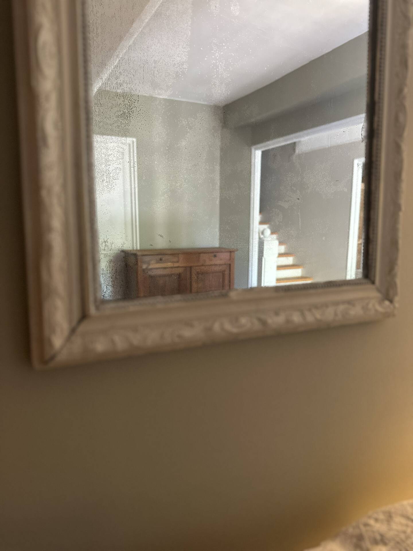 Antique Louis-Philippe mirror with pearls and shells, white patina.