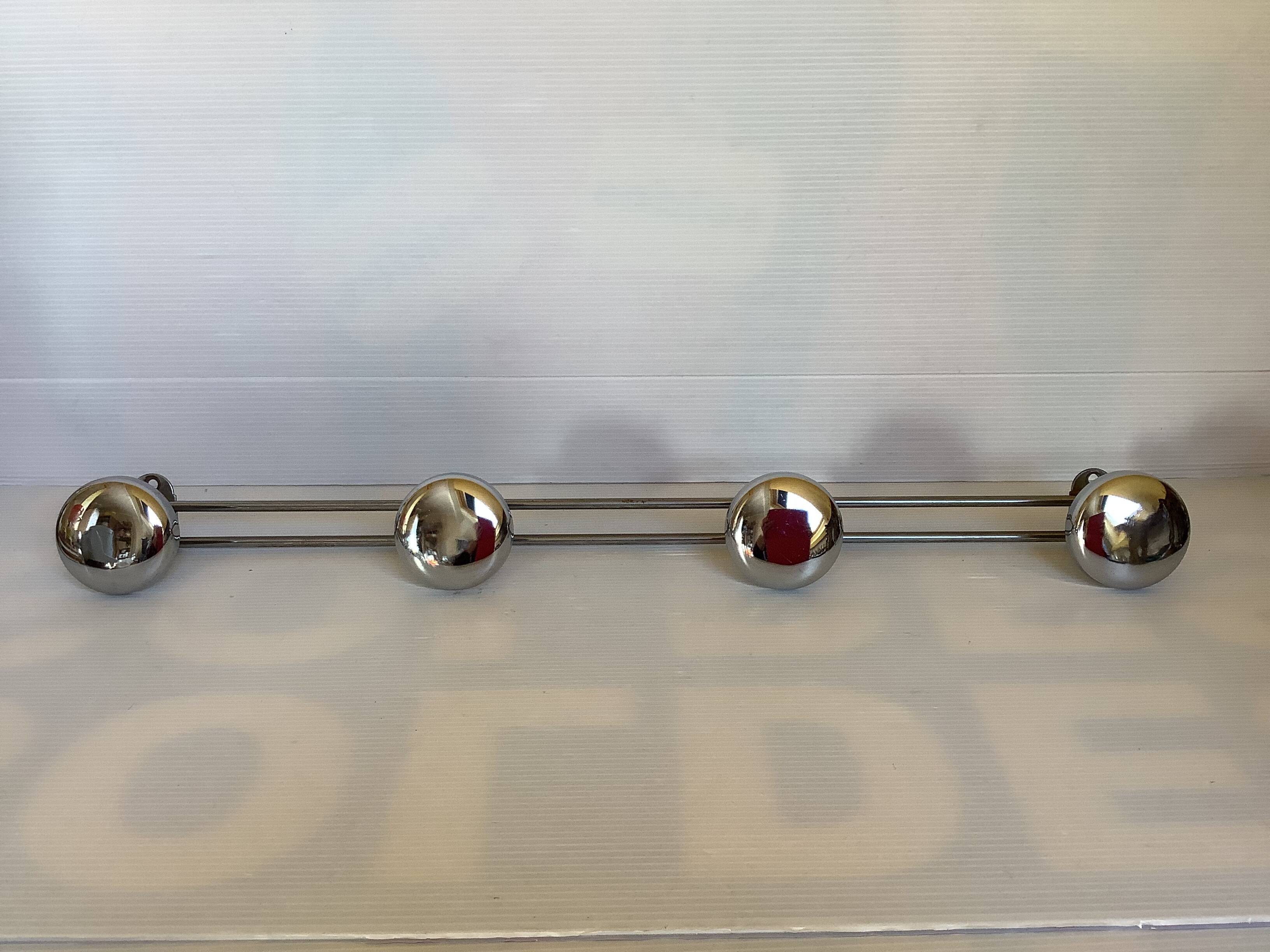 Chromed metal coat rack with four hooks