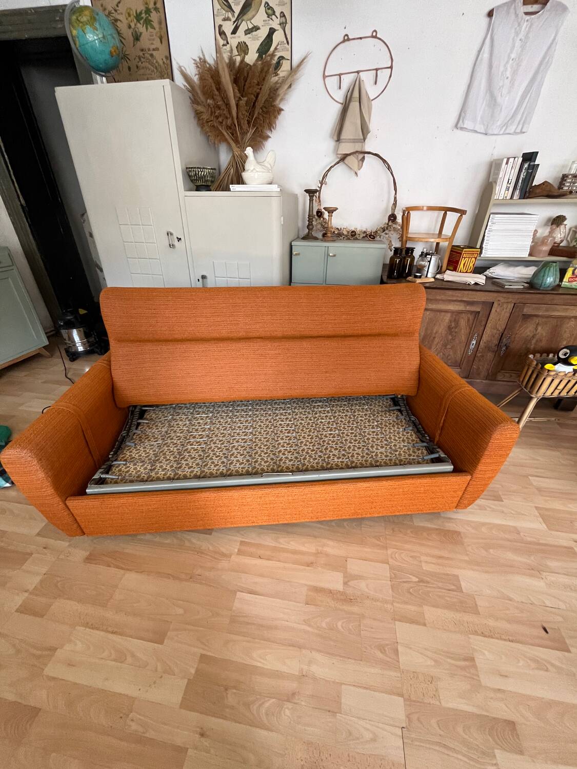 Vintage orange convertible sofa