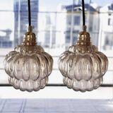 Set of two amber glass pendant lights