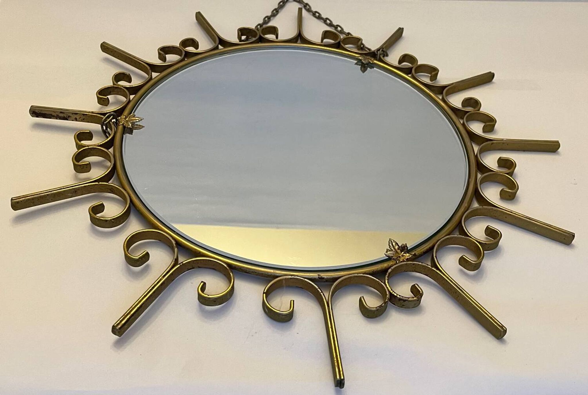 Miroir soleil en métal doré