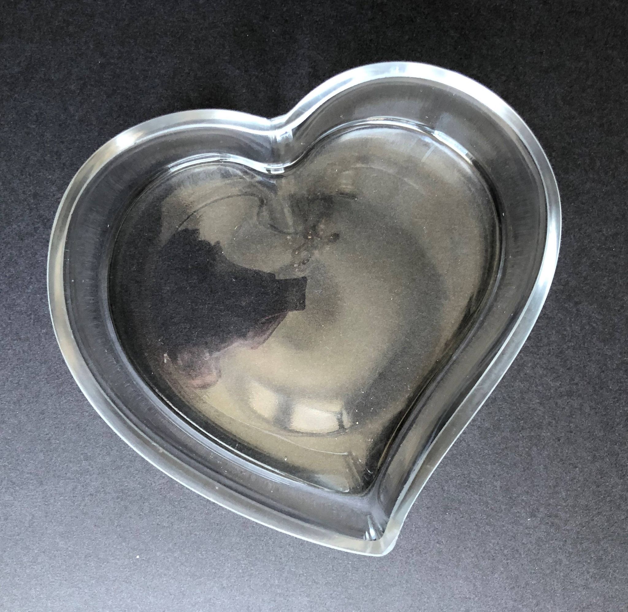 Empty glass heart-shaped pocket