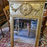 Golden patinated trumeau mirror