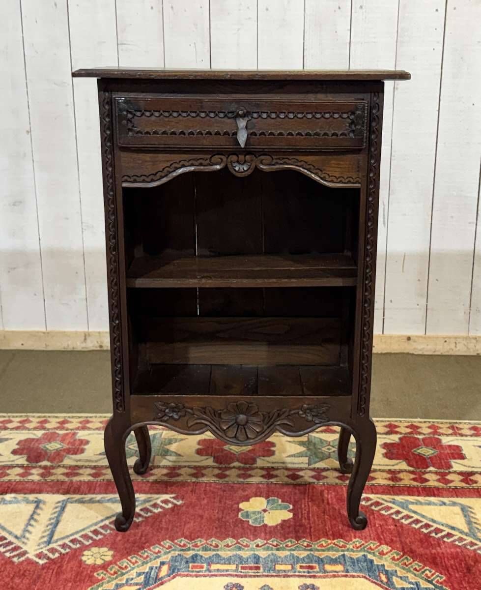 Oak accent furniture bookshelf with a drawer, early 20th century work.
