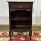 Oak accent furniture bookshelf with a drawer, early 20th century work.