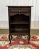 Oak accent furniture bookshelf with a drawer, early 20th century work.