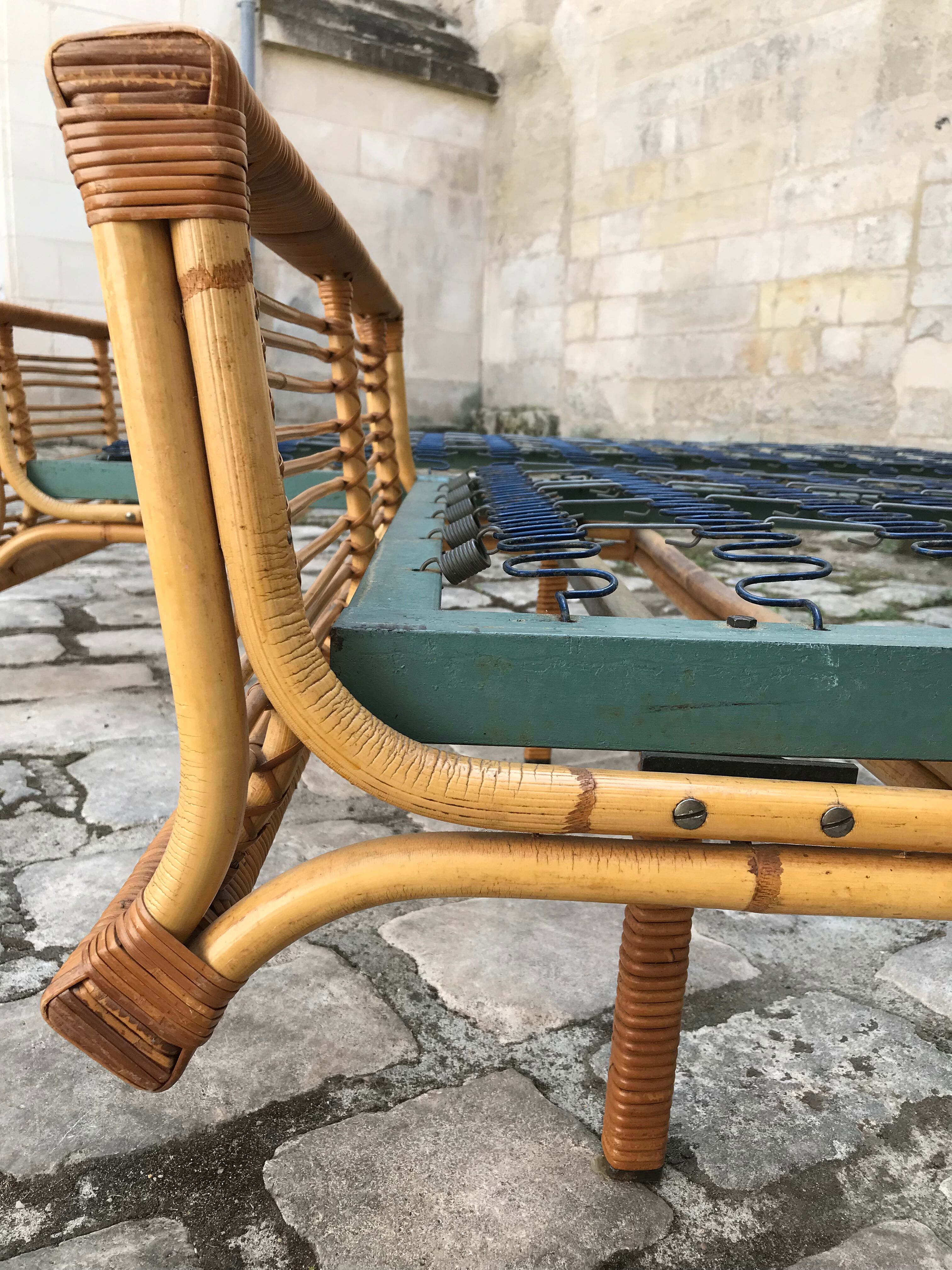Twin rattan beds with built-in bedside tables