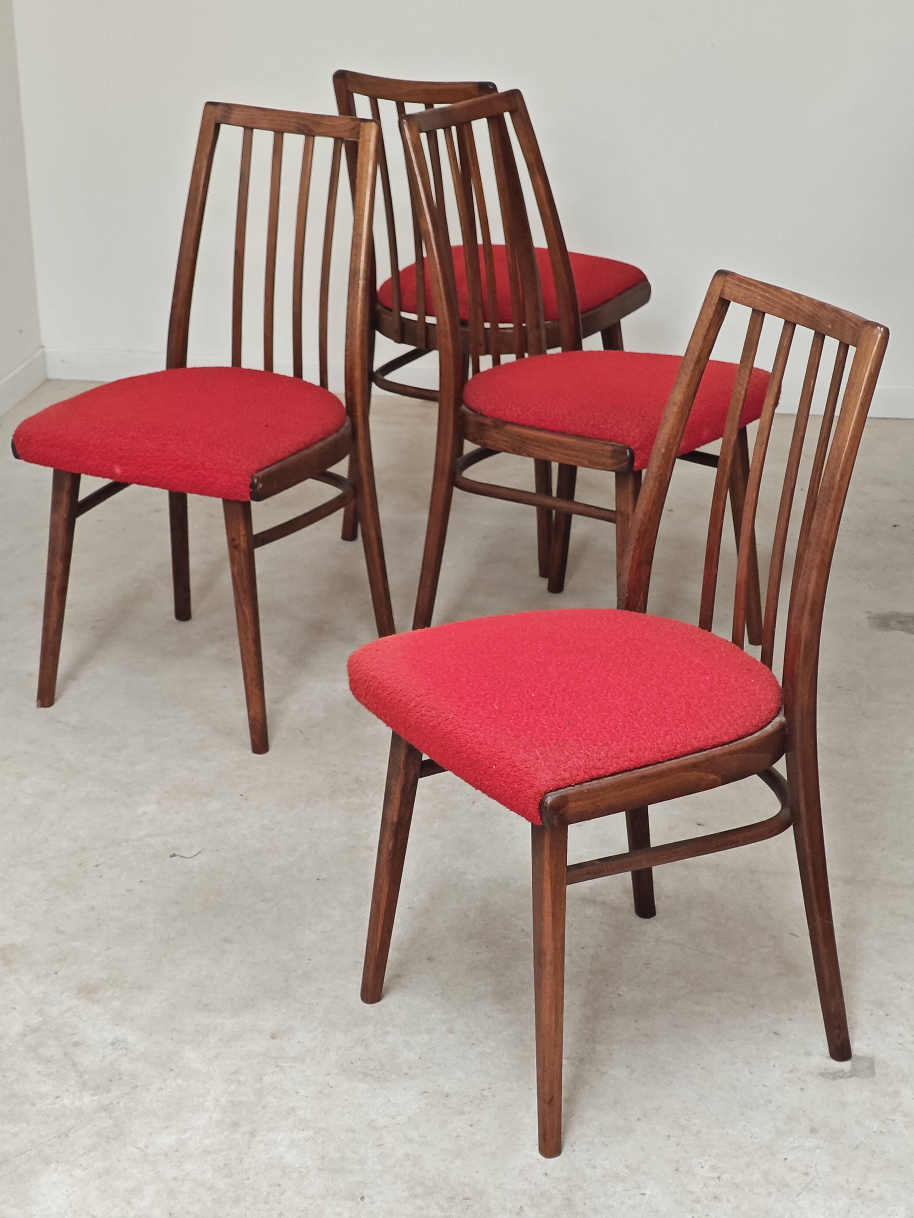 Set of 4 red dining chairs by Antonin Suman for Interier Praha.