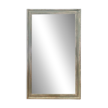 Antique mirror with a green and white patina.