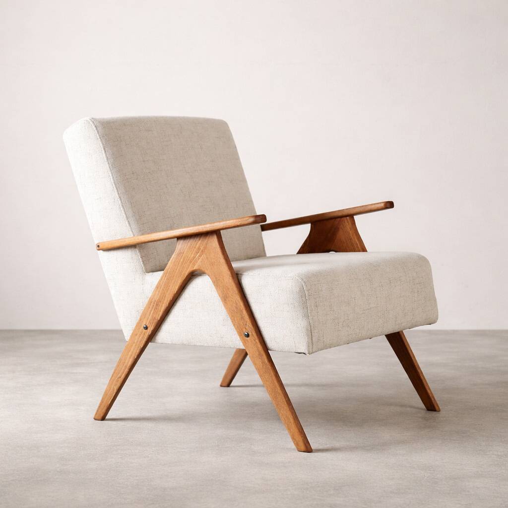 Mid-century modern armchair in solid wood and light beige fabric.